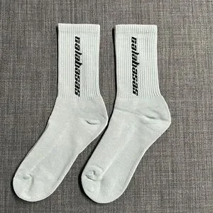 Yeezy Calabasas 3 Pack Socks on feet with Yeezy 700 Wave Runner